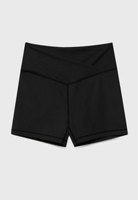 Zwarte sportshorts met een aansluitend ontwerp, met een gekruiste tailleband, een gladde textuur en contrasterende stiksels langs de randen.