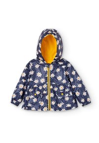 Veste de pluie enfant bleu marine avec motifs marguerites blanches, fermeture éclair jaune, deux poches avant, poignets élastiques et capuche doublée jaune.