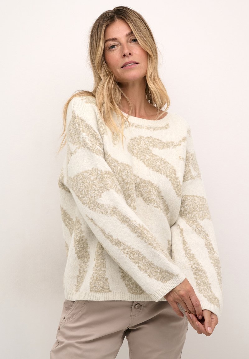 Maglione color crema con un motivo astratto beige testurizzato, maniche larghe e scollatura rotonda. Tessuto morbido e lavorato a maglia.