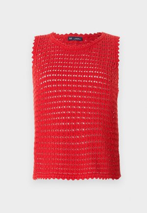 Punane ilma varrukateta kudum, millel on avatud kudumise mustriga disain, lainelised äärised ja ümmargune kaelus. Kerge kangas, ideaalne sooja ilma jaoks.