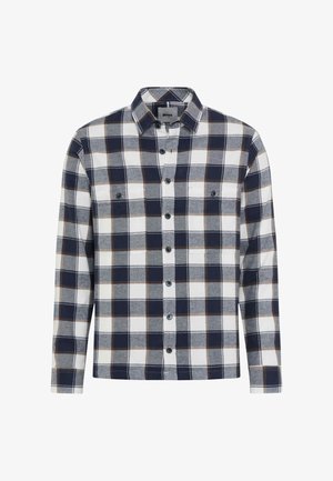 Camicia a maniche lunghe a quadri nei toni blu navy, bianco e marrone. Realizzata in cotone con chiusura a bottoni e due tasche sul petto. Tessuto morbido.