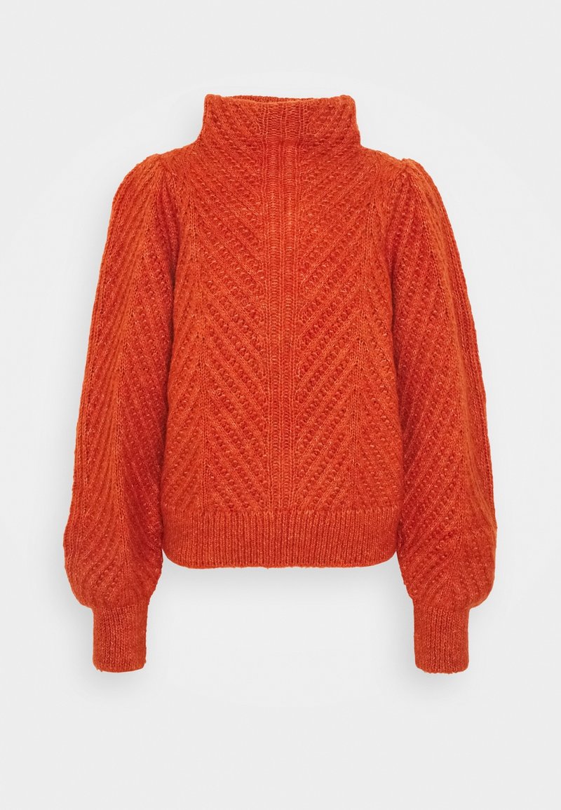 Pull en tricot orange avec col montant, motif en chevron, manches longues bouffantes, poignets et ourlet côtelés.