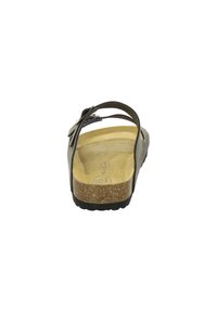 Black sandal with a cushioned cork footbed, adjustable strap, and textured sole. Open back design with minimalistic appearance.