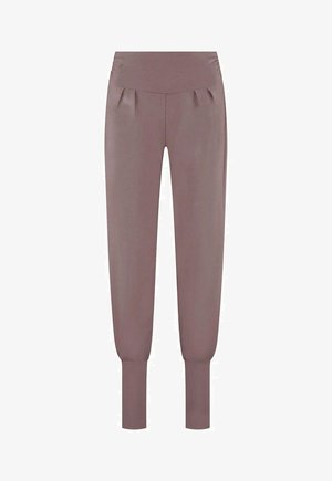 Vaaleanruskeat, korkeavyötäröiset juoksuhousut, joissa on laskosyksityiskohtia edessä, kapenevat hihansuut ja sileä pinta.