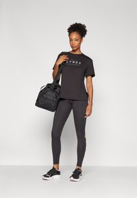 Puma HYROX CLOUDSPUN - Leggings - black