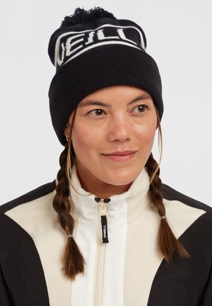 Black knit beanie with white "O'Neill" logo, featuring a pom-pom on top, textured ribbing, and a snug fit.
