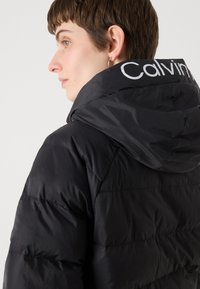 Calvin Klein Jeans LIGHTWEIGHT LOGO PUFFER - Vinterjakke - black