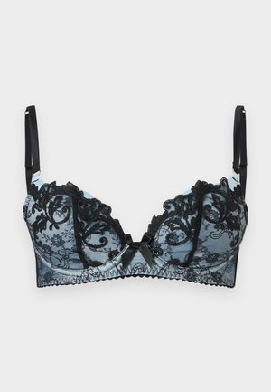 Soutien-gorge bleu clair avec superposition de dentelle florale noire, bretelles noires réglables, bonnets à armatures et petit nœud noir au centre devant.