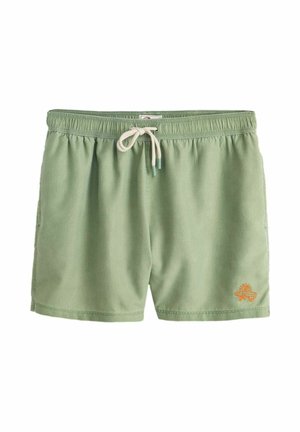 Hellgrüne Badeshorts mit elastischem Bund und beigem Kordelzug, mit einem kleinen orangefarbenen Sonnen- und Surfbrett-Logo am linken Bein.