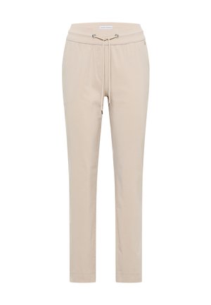 Pantalon beige fuselé avec taille élastique et cordon de serrage, doté d'œillets en métal et d'ourlets cousus.