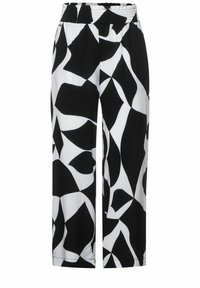 Černobílé široké kalhoty s elastickým pasem, zdobené abstraktními tvary a vyrobené z hladkého, lehkého materiálu.