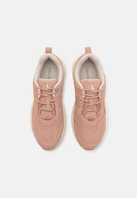Pink suede sneakers with a textured finish, featuring a high-top design, lace closure, and contrasting light-colored sole. Logo on tongue.