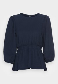 Blusa peplum azul marinho com decote redondo, cintura elástica e mangas longas bufantes. Tecido texturizado com um padrão subtil.
