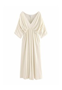Vestido color crema con escote en V, mangas cortas de gran tamaño, cintura fruncida y tejido fluido, diseñado para una silueta de ajuste holgado.