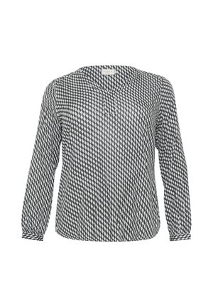 Blusa de patrón en blanco y negro con mangas largas, escote en forma de V y puños fruncidos. Tejido ligero con un diseño geométrico de diamantes.
