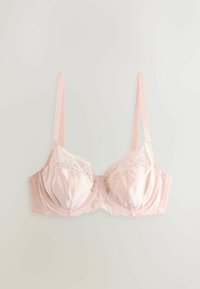 Soutien-gorge en dentelle et satin rose clair avec bonnets à armatures et bretelles fines réglables sur fond uni.