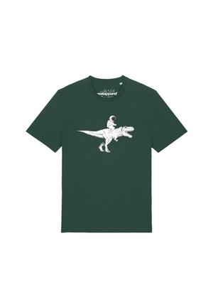T-shirt vert foncé avec un graphisme blanc d'un astronaute chevauchant un dinosaure Tyrannosaure rex rugissant.