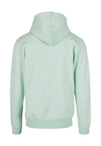 Felpa con cappuccio verde menta chiaro, in misto cotone, con un ampio cappuccio e polsini e torso a costine. Design semplice, senza motivi o hardware visibile.