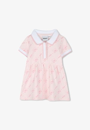 Roze polo jurk met korte mouwen, witte kraag en een speels herhalend patroon van dierengezichten, gemaakt van zachte katoen.