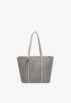 Sac cabas gris avec longues anses, détail nœud à l’avant et logo subtil, conçu pour un usage quotidien.