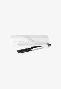 Sèche-cheveux styliseur professionnel 2-en-1 en noir et blanc, présenté ouvert devant son emballage blanc.