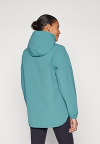Teal vanntett jakke med hette, med lange ermer og avslappet passform, glatt tekstur og elastiske mansjetter.