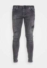Jeans ajustados de denim gris oscuro, con detalles rasgados en las rodillas y un diseño clásico de cinco bolsillos con cremallera.