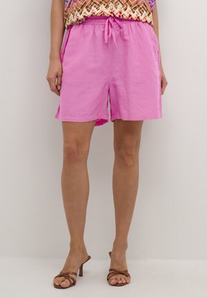 Pink linen shorts with an elastic waistband and drawstring. They feature side pockets and a relaxed fit, with a hem hitting mid-thigh.