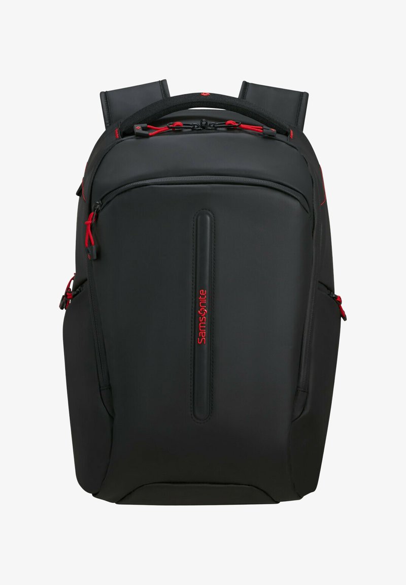 Sac à dos Samsonite noir avec des accents rouges, texture lisse, bretelles rembourrées, plusieurs compartiments zippés et une poignée supérieure.