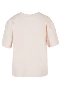 Pale pink short-sleeve t-shirt with round neckline, soft cotton material, and a relaxed fit. No visible graphics or embellishments.