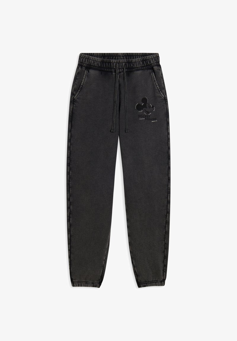 Pantalons de survêtement noirs avec une taille élastique, cordon de serrage, poches latérales et un graphique de Mickey Mouse sur le haut de la cuisse gauche. Texture lisse.