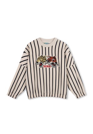 Chemise beige à manches longues avec des rayures verticales noires et des têtes de léopard et de tigre brodées au-dessus du texte rouge Kenzo à l'avant.