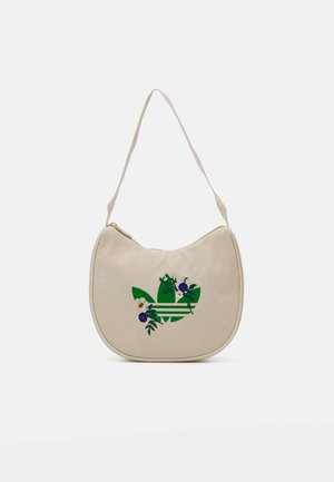 Beige stoffen schoudertas met rits en groen bladlogo, versierd met paarse en witte bloemen aan de voorkant.