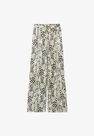 Pantalones de pierna ancha con estampado de leopardo y cintura con cordón, en colores beige y negro, hechos de tela ligera con una textura suave.