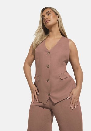Blush pink tailored vest with a v-neck, five buttons, and two side pockets, made from textured fabric. Paired with matching wide-leg pants.