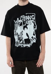 Black cotton t-shirt featuring a graphic print of "Wu-Tang Clan" and a logo in light blue. Relaxed fit with short sleeves and crew neck.