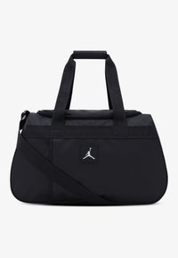 Black duffel bag made of durable fabric, featuring two top handles, a detachable shoulder strap, and a white logo patch.