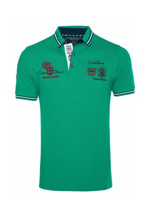 Zelená polokošeľa s krátkym rukávom, námořnicky pruhovaný golier a manžety, s červenými a čiernymi nášivkami loga rugby ligy na hrudi a rukáve.