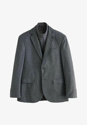 Gray herringbone blazer made of textured fabric, featuring a notched lapel, two front pockets, and a single button closure.