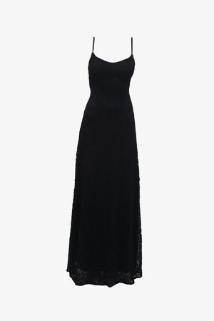 Black lace maxi dress with thin spaghetti straps, fitted bodice, flared skirt, and intricate lace pattern throughout the fabric.