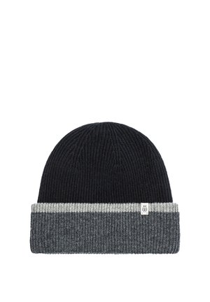 Knitted winter beanie with dark top and gray folded cuff featuring a small white label on a white background.