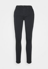 Vaqueros skinnies negros con cierre de botón, cremallera, bolsillos frontales y una textura suave. Diseño ajustado desde la cintura hasta el tobillo.