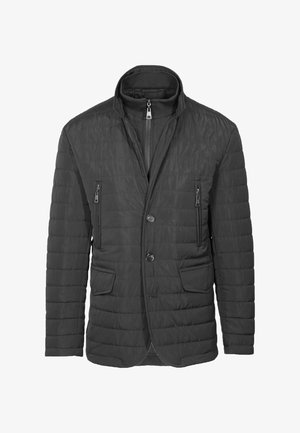 Giacca nera trapuntata con colletto alto, zip frontale, due tasche laterali e chiusura a bottoni. Materiale leggero, texture liscia.