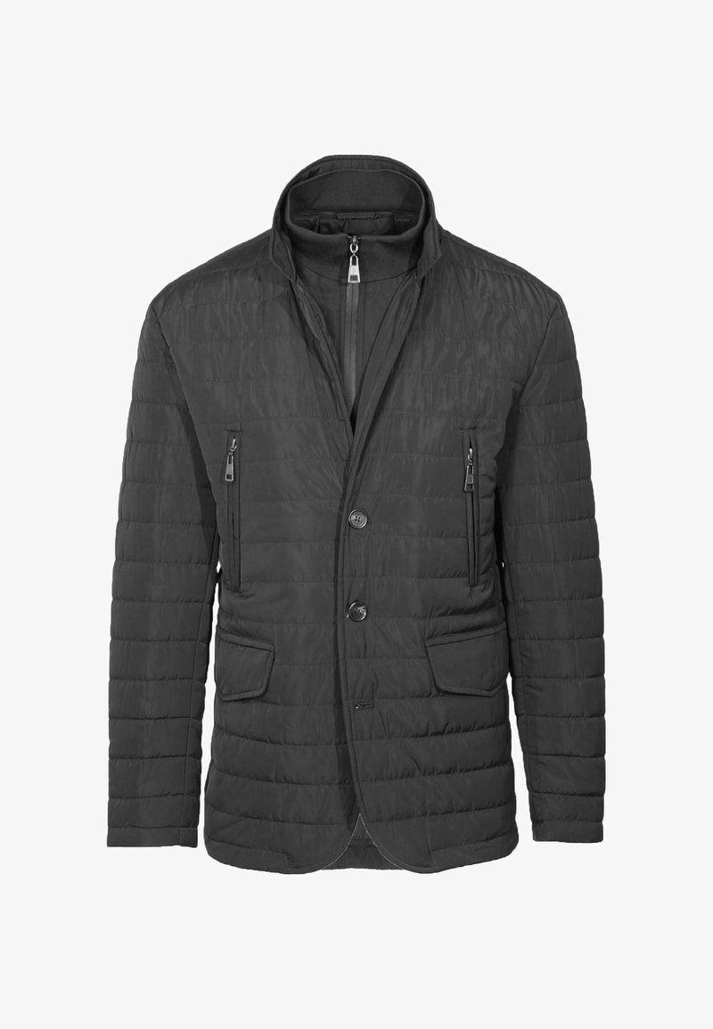 Giacca nera trapuntata con colletto alto, zip frontale, due tasche laterali e chiusura a bottoni. Materiale leggero, texture liscia.