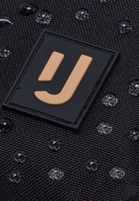 Johnny Urban JUNO - Mobiltaske - black