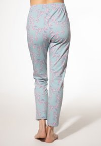 Light blue pajama pants with pink floral print, elastic waistband, tapered shape, and ankle-length design. Soft fabric texture.