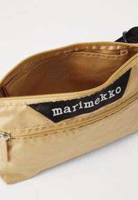 Marimekko NEAT CROSSBODY SOLID S - Skulderveske - beige
