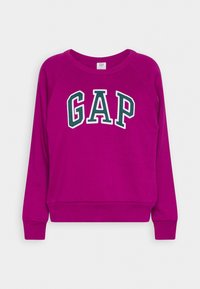 Sweat-shirt magenta à manches longues avec poignets et taille côtelés, avec texte du logo GAP en vert et blanc sur la poitrine.