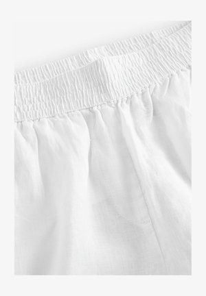 Fehér, rugalmas derékpánt, könnyű anyagból készült. Simaságával és enyhe fényességével, valamint diszkrét áttetsző megjelenésével rendelkezik.