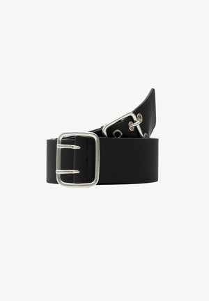 Must muströöp muströöp kaunistava nahk, rohelise värvi metallist kinnitusega. Siledat tekstuuri ning mitmeid reguleerimislõikeid mööda pikkust.